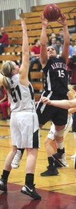 Albert Lea senior Dominique Villarreal shoots over Faribault’s Stephanie Thielbar. Villarreal earned eight points, seven rebounds, three assists and a steal in the Tigers’ 64-51 win on Friday. -- Micah Bader/Albert Lea Tribune