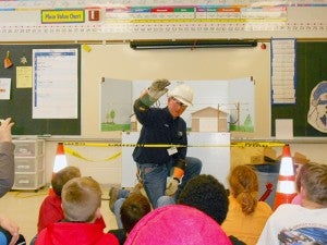 Loren Sprague from Freeborn-Mower Cooperative Services demonstrates current and safety March 1 to fourth- and fifth-graders at Alden-Conger school. --Submitted