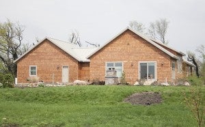 The home of Glenn and Gretchen Boldt has been rebuilt next to the couple’s business, Hilltop Gardens & Farms, since the June 17, 2010, tornadoes. 