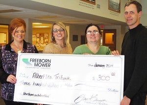 Freeborn-Mower Cooperative Services donated a $300 grant through its Operation Round-Up toward the Albert Lea Tribune’s Newspapers in Education program. NIE supplies newspapers to teachers free of charge for use in classrooms. From left are Freeborn-Mower Communications Assistant Dawn Schroeder, Tribune Publisher Crystal Miller, Tribune Circulation Manager Melissa Goodwin and Tribune Editor Tim Engstrom. --Submitted