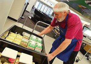 Don Fair, a nutrition assistant at Capitol Hill Magnet School, prepares food for the Breakfast to Go Program on Tuesday, May 6, 2014 in St. Paul. – Peter Cox/MPR News