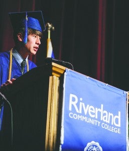 Riverland graduate Clyde Carver, a 16-year-old from Austin, gives his address Friday night during the Riverland Community College commencement exercise at Knowlton Auditorium. Eric Johnson/Albert Lea Tribune