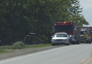 A red pickup truck, pictured in the ditch to the left, and a silver sedan collided Wednesday afternoon on Freeborn County Road 46. – Colleen Harrison/Albert Lea Tribune