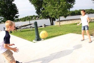 Children play Tuesday at the rededication of Fountain Lake Park.