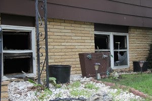 Evidence of a fire at 706 Knoll Road is evident Monday afternoon by looking at the broken windows of the home. – Sarah Stultz/Albert Lea Tribune