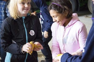 Third-graders from United South Central School got a chance to shell corn themselves after learning how a combine harvester does it at Gary Braaten’s hog farm near Austin. – Hannah Dillon/Albert Lea Tribune