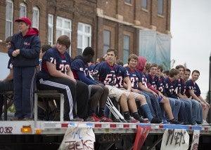 Albert Lea football players partake in the Homecoming parade Thursday on Broadway in downtown Albert Lea. — Colleen Harrison/Albert Lea Tribune