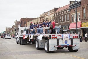 The Homecoming parade drives through downtown Albert Lea Thursday. — Colleen Harrison/Albert Lea Tribune