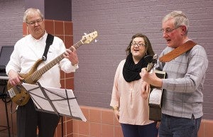 From left, Jamie Kyllo, Cassi Schreiber and Paul Goodnature perform Monday evening before the start of the Martin Luther King Jr. program at Riverland Community College. - Sarah Stultz/Albert Lea Tribune 