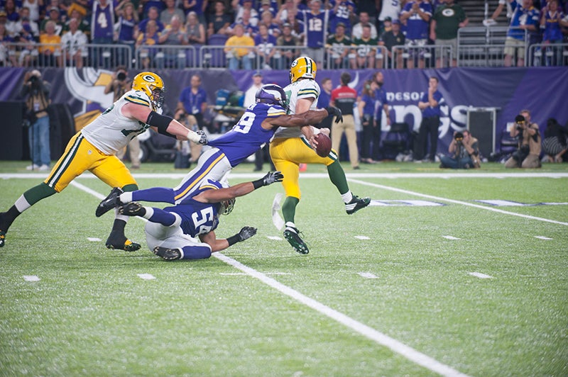 Minnesota Vikings' Danielle Hunter sacks Green Bay Packers' Aaron Rodgers  during the second hal …